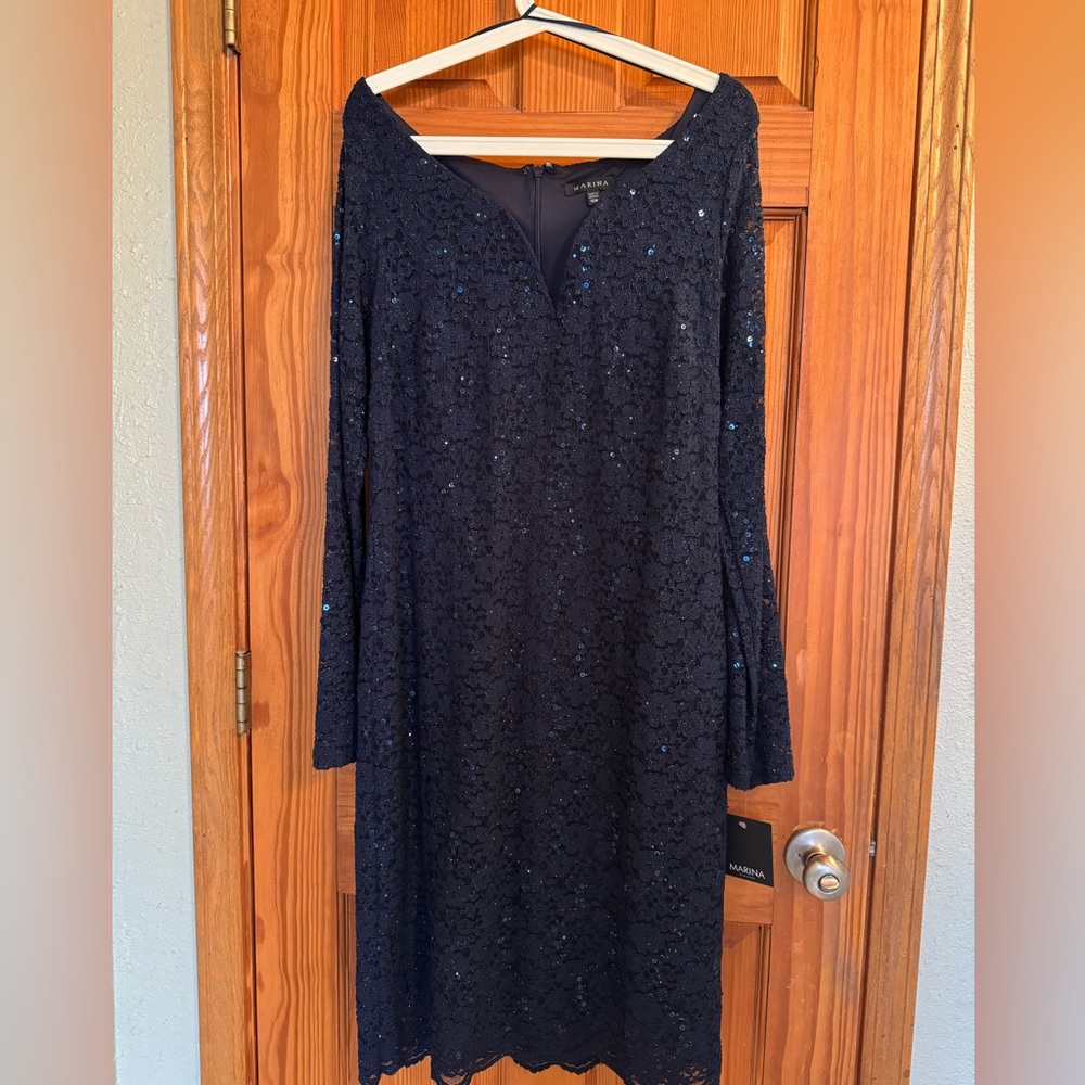 New with tags formal dress by Marina. Stored in a smoke free home.